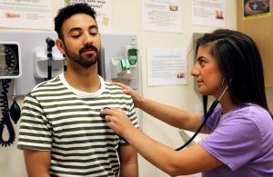 Elisa assisting a male patient